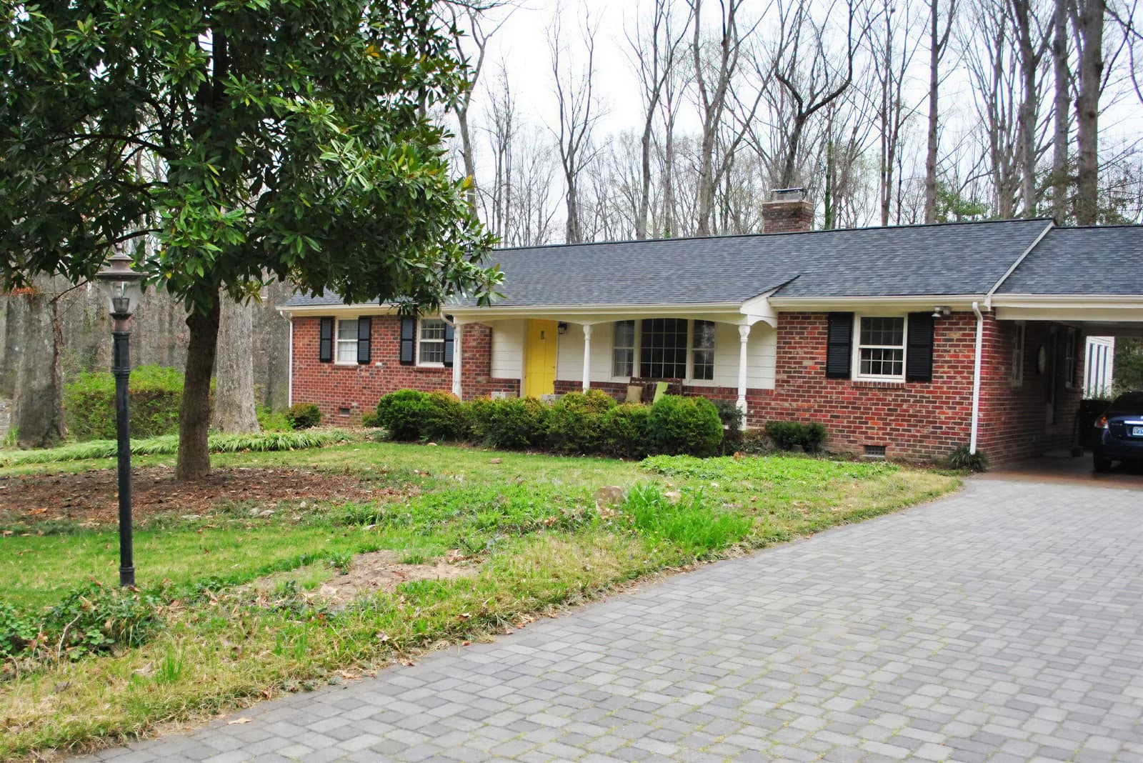 Your photo: Ranch with a magnolia and paver drive