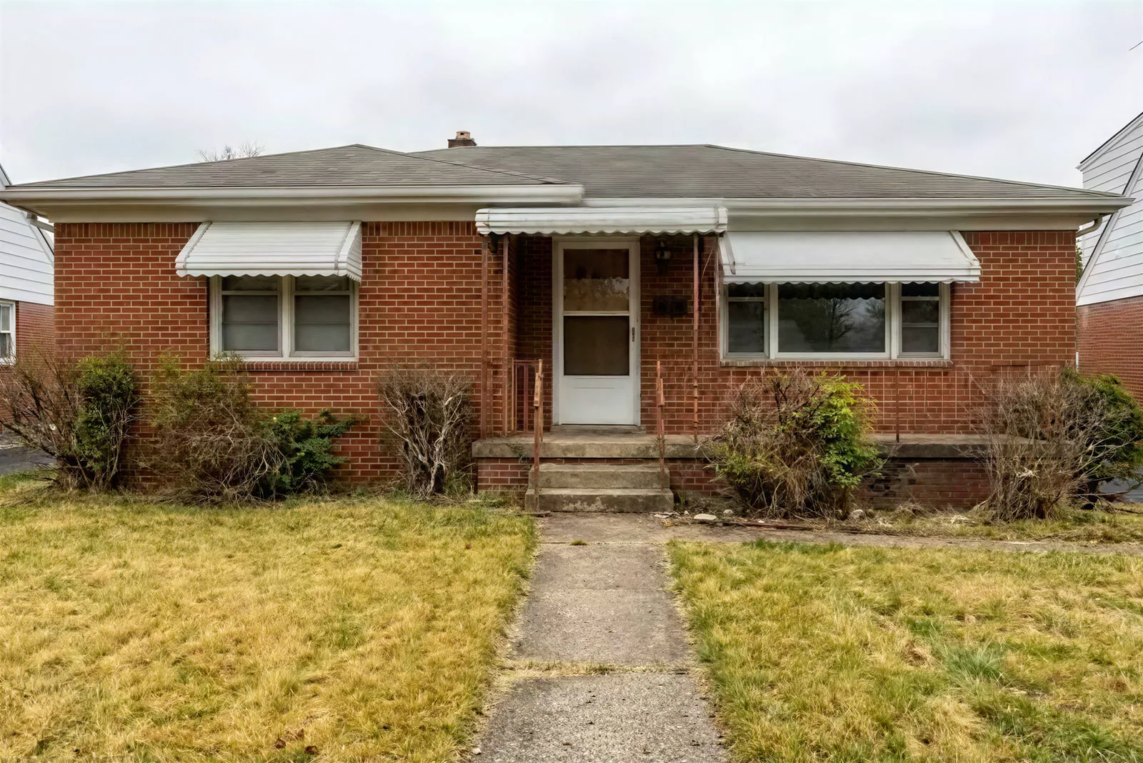 Before: the real photo of the brick ranch
