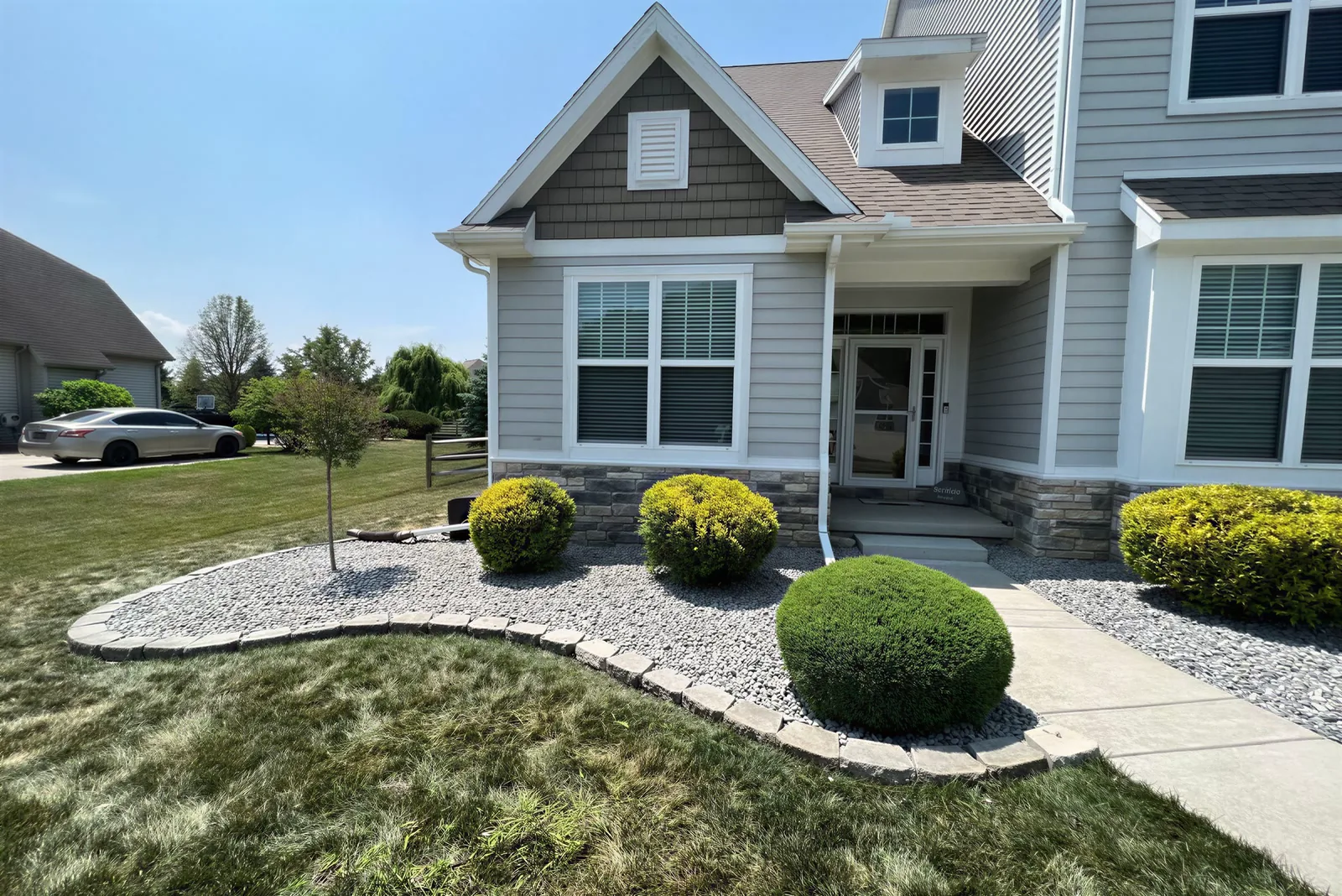 Before: the real photo of the front bed and curved walk